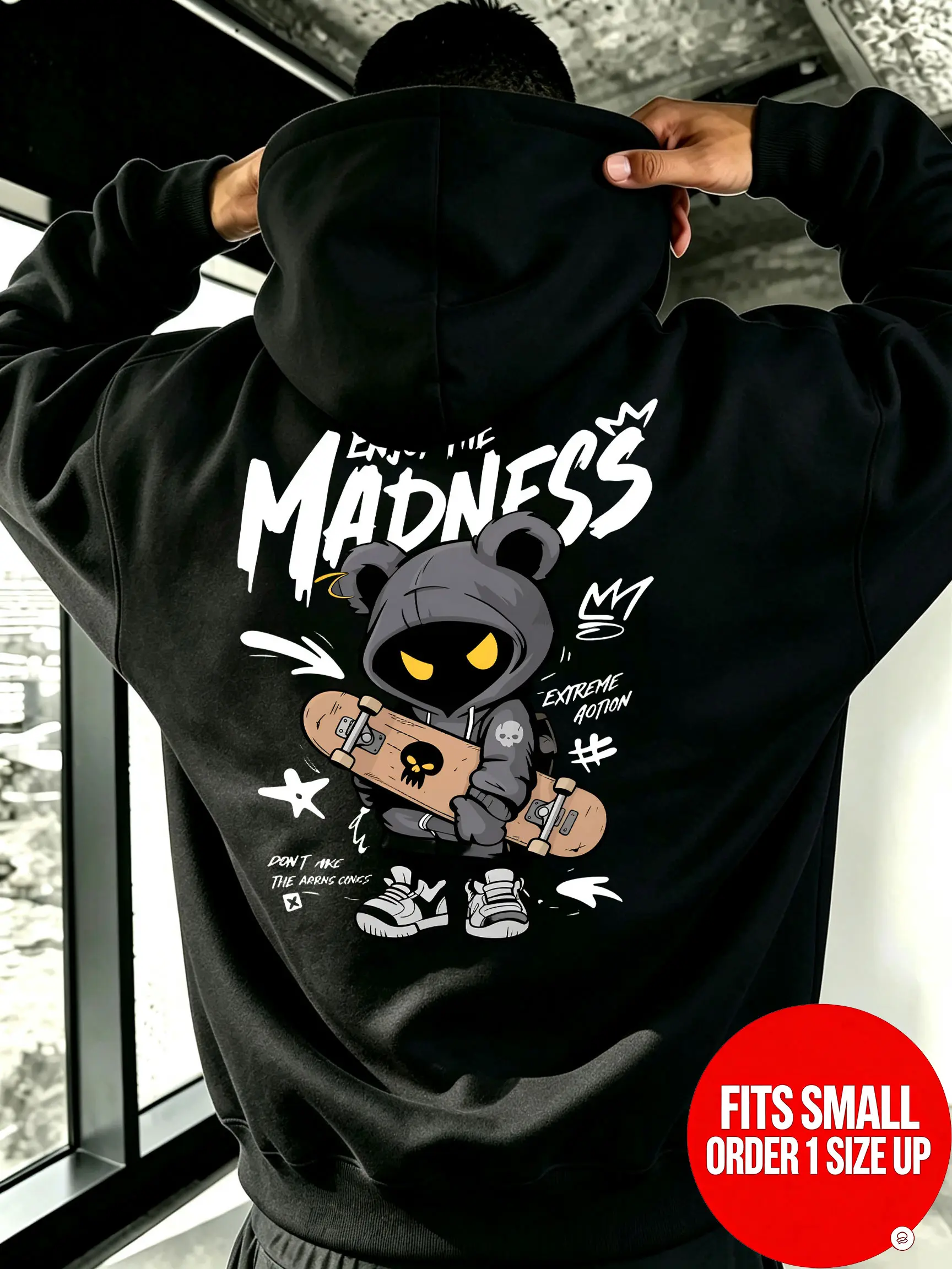 Enjoy the Madness hoodie — double print design, front handwritten brush-style lettering, back skateboard bear cartoon illustration; unisex oversized hoodie