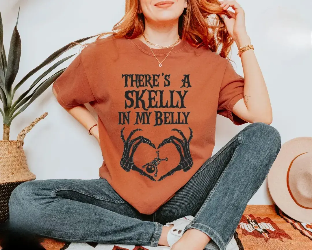 Comfort Colors There's A Skelly In My Belly Shirt, Funny Halloween Pregnancy Announcement T-Shirt, Baby Skeleton Hands Heart Maternity Tee, Spooky Mom To Be Gift - Century Cotton Co.