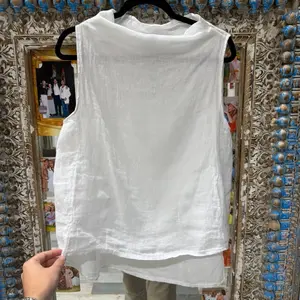 One size linen top fits from extra small to large Tania 100 percent linen sleeveless breathable relaxed fit lightweight summer top flowy minimal chic Mediterranean style easy everyday wear resort wear beach outfit versatile layering piece natural fabric s