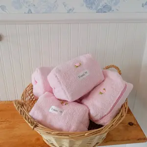 Pink terry makeup pouch with bow charm