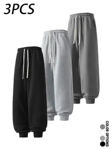 Pack of 3 men’s casual sweatpants for spring/autumn, cuffed long pants with a simple solid color design, drawstring elastic waistband, loose fit—suitable for everyday wear, leisure activities, and fitness.
