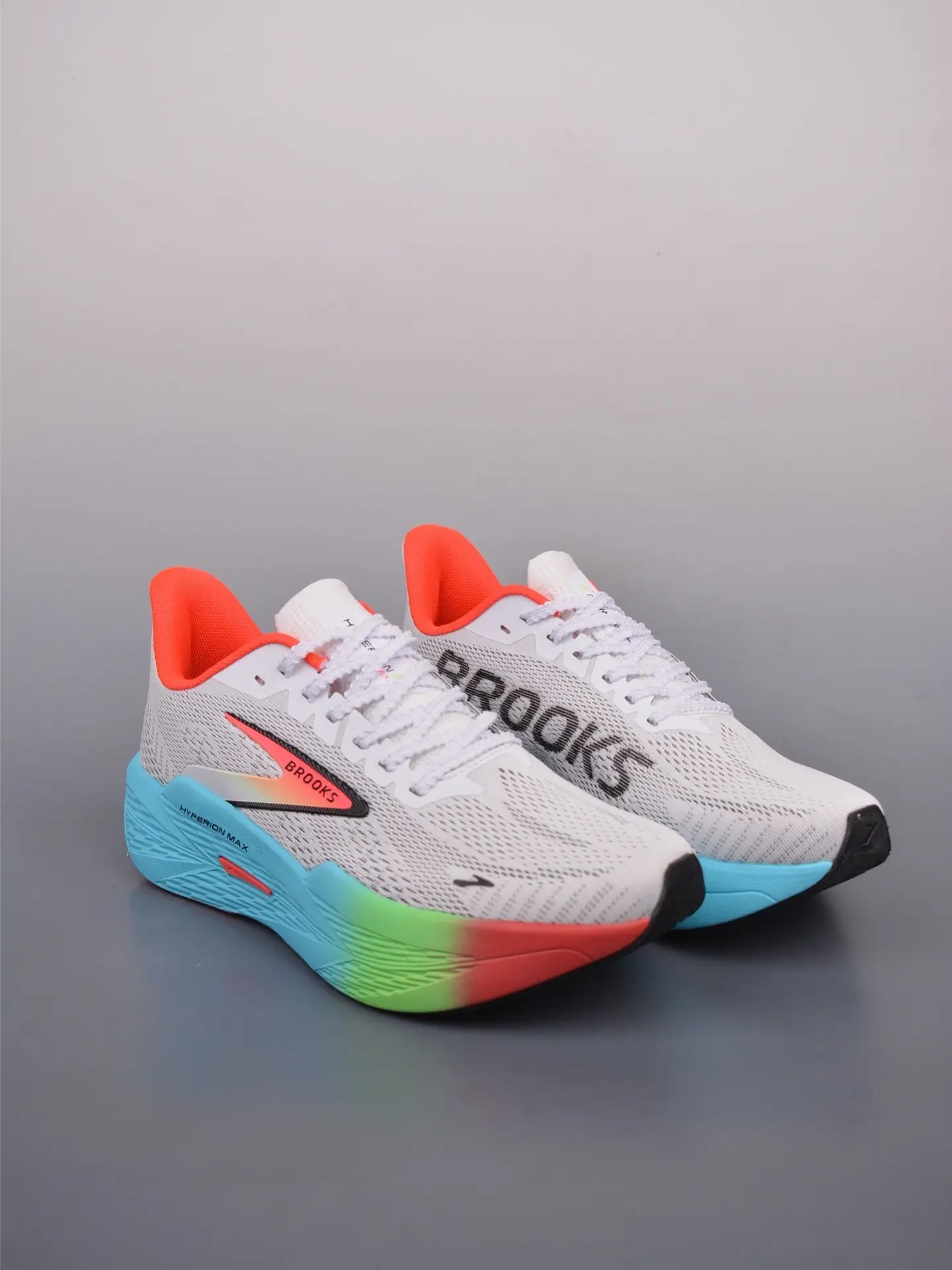 White woven knit mesh trainers colorful gradient cyan green red thick foam midsole bright orange soft fabric lining lightweight lace-up athletic running sneakers