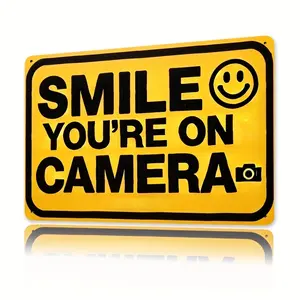 2D Flat, Vintage Metal Wall Sign "Smile You're On Camera"| 8x12 Inch Yellow Iron Decor with Black Text & joyful Face| Durable, Humorous Art for Home, Office, Bar, Kitchen, Bathroom, Garden, Garage| Retro Style with Camera Icon| Eye-Catching Safety Alert P
