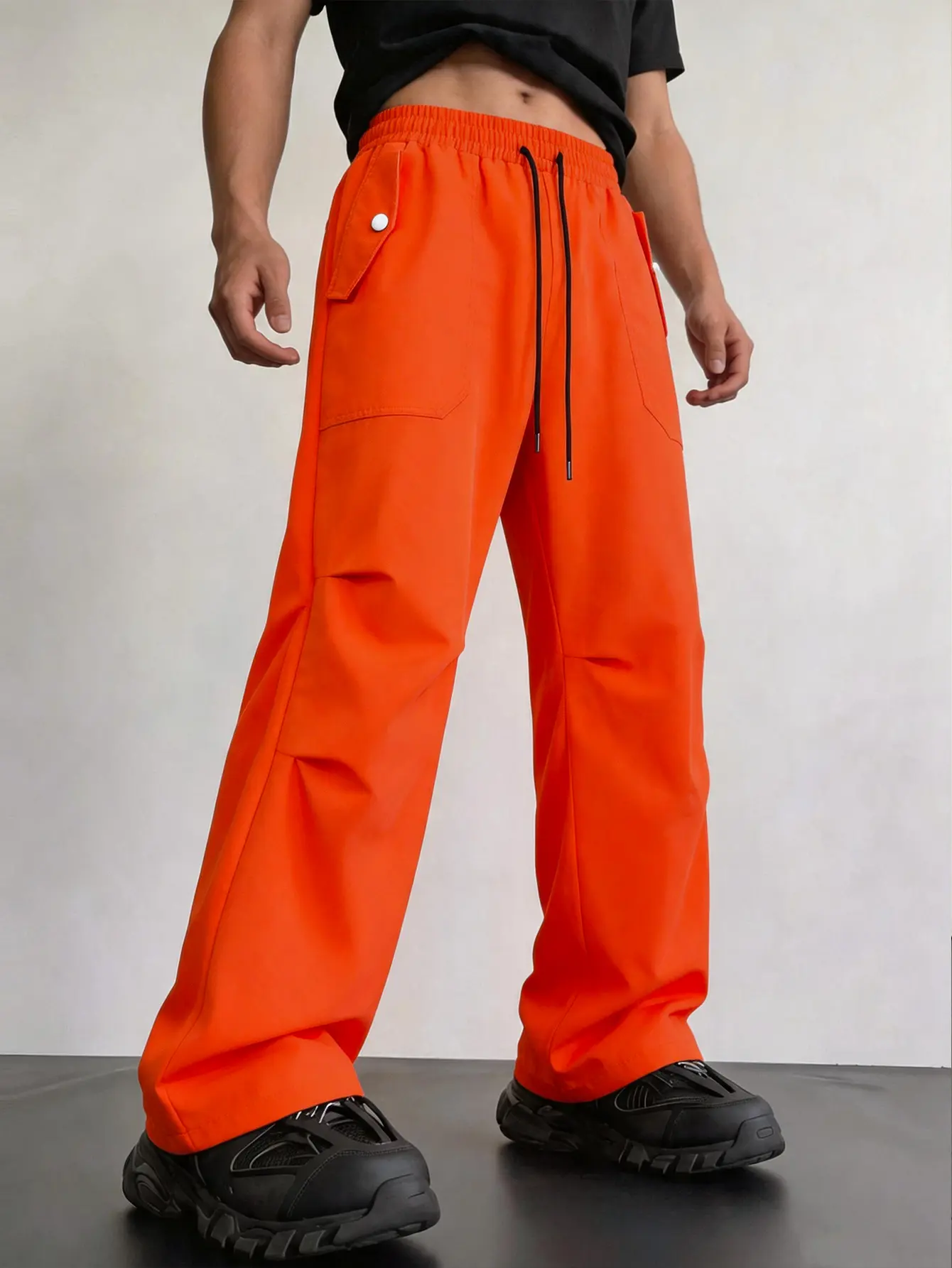 Men’s Y2K retro orange wide-leg athletic pants, American campus style, street trend style, drawstring elastic waistband, lightweight fabric, street sports style, high saturation eye-catching design, everyday casual style