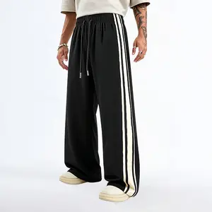 Men’s casual wide-leg pants made from lightweight, comfortable fabric, featuring an elastic drawstring waist and side stripe accents—ideal for street style, everyday wear, home wear, and summer outfits.