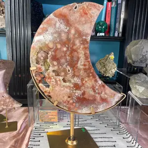 Red amethyst and quartz moon from Brazil on spinning stand