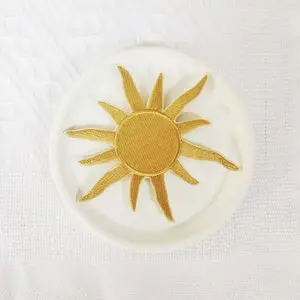 1PCS golden sun pattern embroidered cloth patch, suitable for DIY decorative patches on hats, bags, shoes, and clothing. Made of durable materials with back hot melt adhesive that can be sewn, ironed, and washed