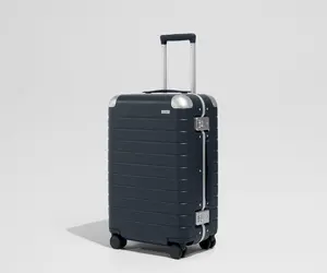 The Aluminum Edge Bigger Carry-On in Navy Blue