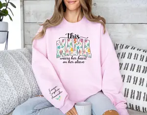 Custom This Mama Wears Her Heart On Her Sleeve Sweatshirt, Personalized Mom With Kids Names Apparel, Motherhood T-shirt, Mother's Day Gifts