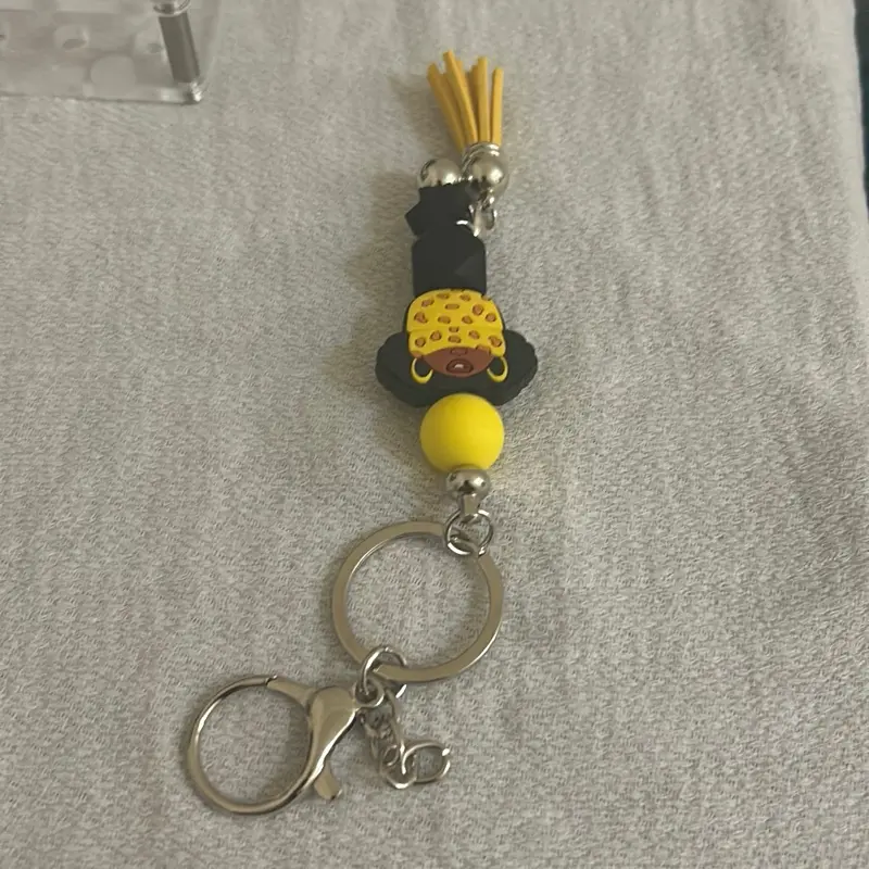 Diva Yellow Hat Keychain w/Puffs & Tassel - Stylish Accessory for Keys or Purse Charm - Perfect for Everyday Use