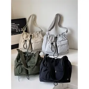 Large-capacity Japanese-style simple drawstring bucket bag for commuting. 2025 autumn new nylon fabric lightweight and versatile shoulder and messenger bag with drawstring cuffs and waterproof nylon material. Suitable for college students, campus, shoppin