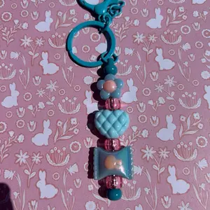 Cute Blue and Pink Keychain with Floral and Geometric Design for Key Storage