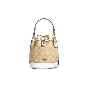 COACH Dempsey 15 Classic Monogram Heart Pendant Drawstring Bucket Bag in Coated Canvas and Leather for Women