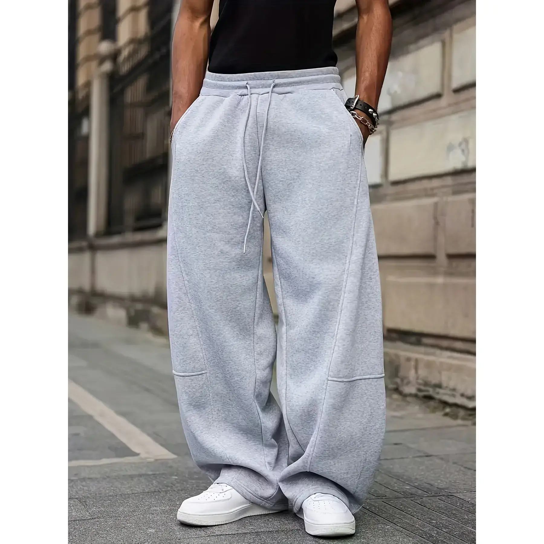 Men's stylish casual wide-leg pants, with a loose fit, featuring a casual and fashionable design. It is a basic style and suitable for both casual and active wear. loose-fit wide-leg pant