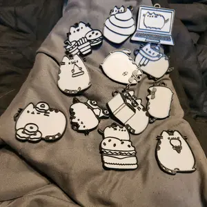 Pusheen-inspired 3D Printed Keychain - Adorable Design Featuring a Pusheen-inspired keychain in Various Poses