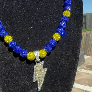Handcrafted Rhinestone Beaded Necklace with Blue and Yellow Rhinestone Beads, Yellow Tone Bolt Rhinestone Charm, and Silver Clip