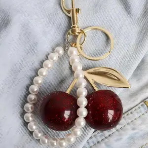 Fashion retro bag accessories charm, cherry keychain, simple sweet cherry pendant accessory, small gift for female friends, holiday small gifts, cherry gold chain handbag pendant strap with pearl strand charm, girly purse fillers