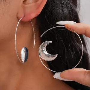 A pair of metal wind asymmetric round moon lady earrings