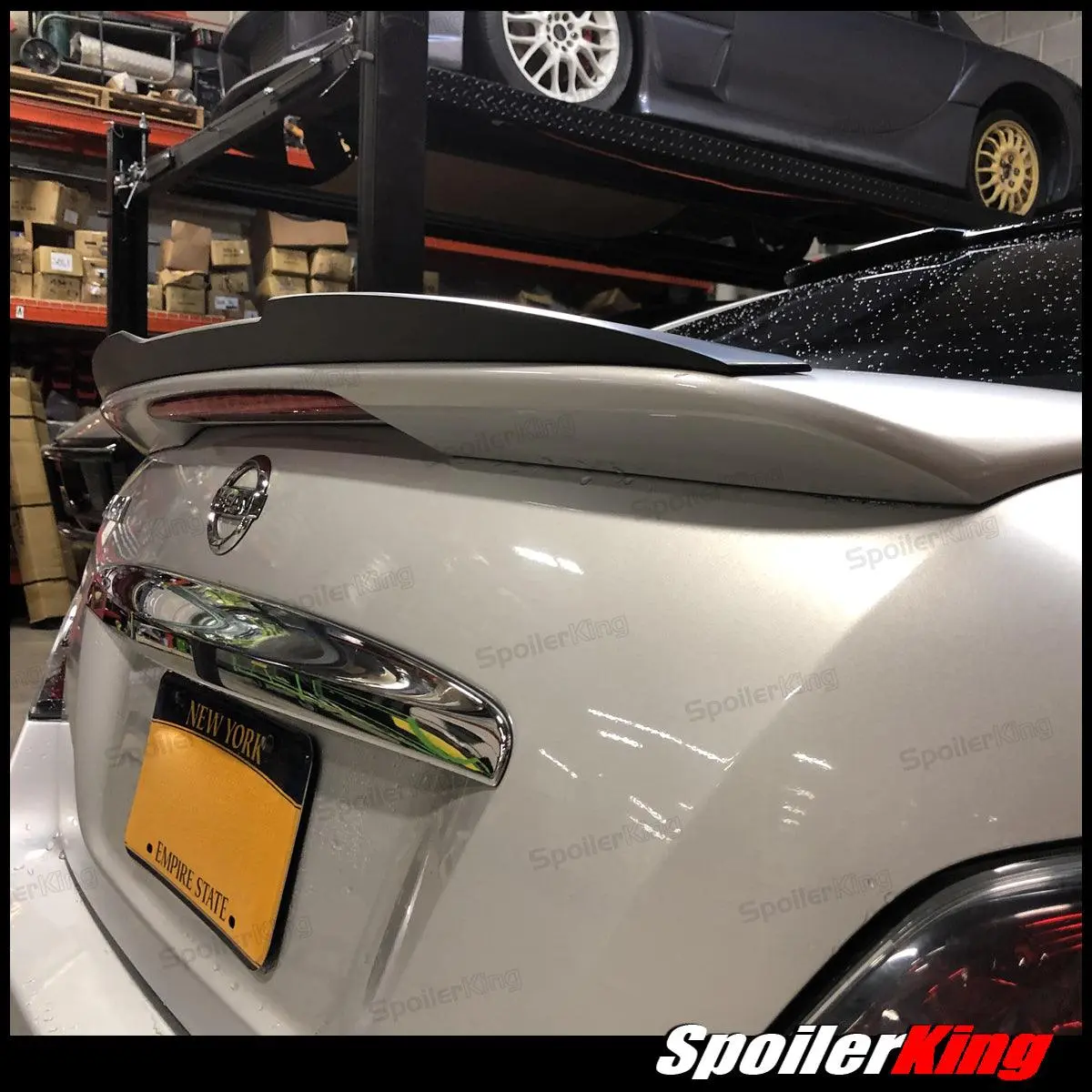 Spoiler King Polyurethane Car Rear Spoiler Extension Gurney Flap with Center Cut, Factory-Style Flexible Fit Auto Accessory with Pre-Installed Tape for Nissan Maxima 2009-2015 (284GFC)