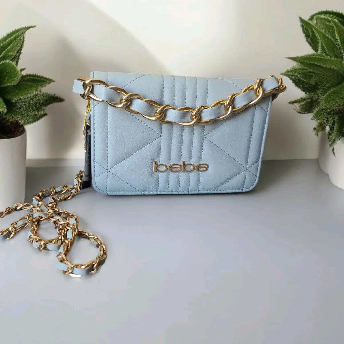 bebe Gia Crossbody bag. color: blue light