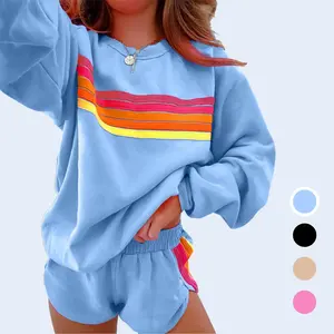 Women’s two-piece casual set featuring a striped accent: long-sleeve sweatshirt and matching shorts. Chic women’s outfit for everyday wear.