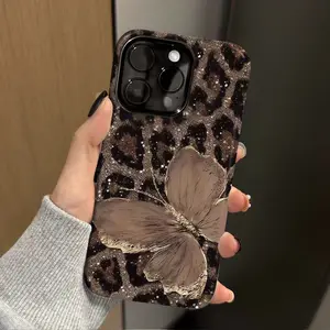 This durable, shock-absorbing, glossy 2-in-1 phone case features a brown leopard print and butterfly pattern. It's compatible with iPhone 17, 16, 15, 14, 13, 12, 11, X, and Samsung models, making it a perfect holiday gift for friends or family.