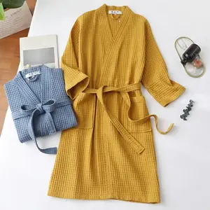 Luxurious waffle-textured nightgown/bathrobe for men and women, featuring lace-up detailing and pockets—soft dressing for beauty.