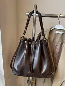 Fashionable and minimalist drawstring bucket bag, drawstring closure design, double long shoulder straps, vintage brown color tone, large capacity shoulder bag, versatile item for daily commuting out of the street, Crossbody Bag