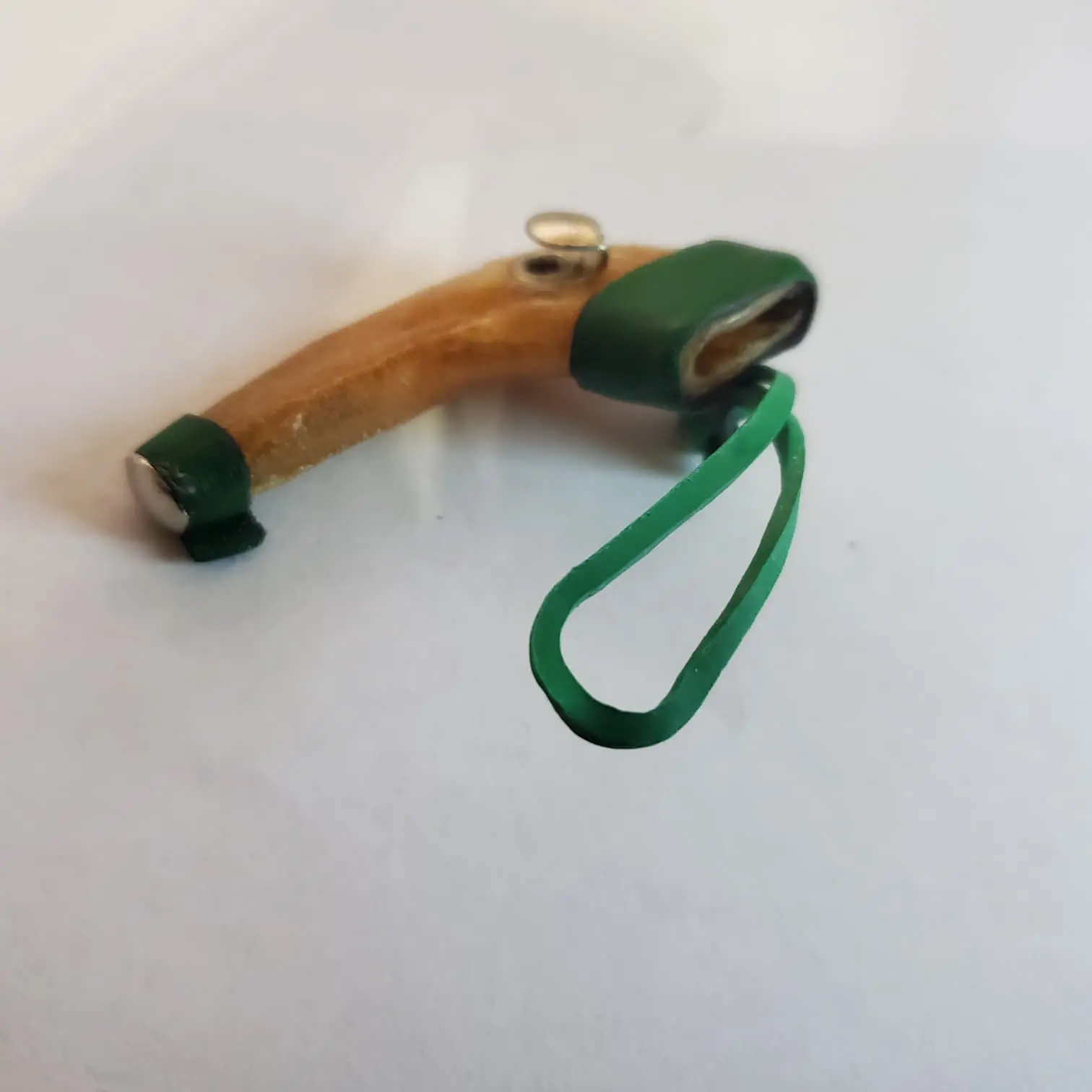 Short scabbard, rawhide, rubber band fastener  Mexican short scabbard, rawhide with rubber band fastener.