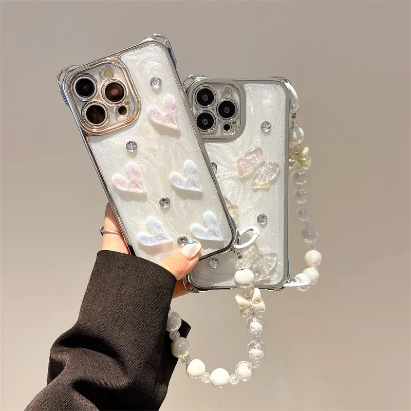 Women's Luxury Bling Rhinestone Laser Butterfly Bow Smartphone Case, 3D Love Heart Pearlescent Cream White Shockproof 4-Corner Cover with Beaded Bracelet Strap for iPhone 12-14 Plus,15-17, Phone Accessories for Protection & Phone Aesthetic