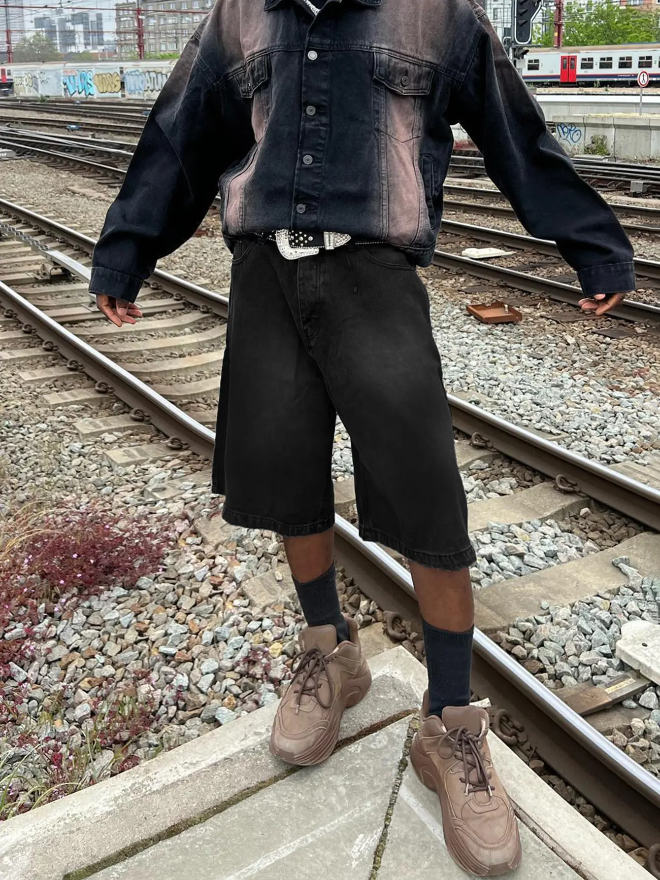 American street washed black denim shorts — loose wide-leg mid-thigh cargo shorts from a high-street brand Menswear