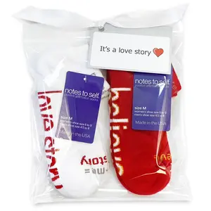 you + me = love story™ white socks and I believe red socks in gift bag
