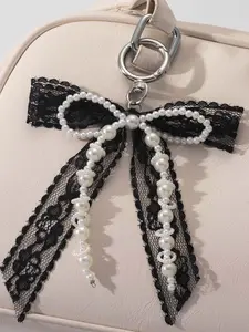 Simple pearl lace bow keychain, black and white contrast beaded pendant, niche design bag pendant, keychain small shoulder crossbody bag small object pendant keychain, Keychain For Bags