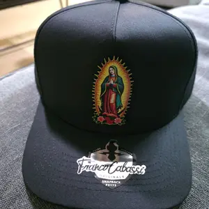 Gorra virgen de Guadalupe  color obscura visera  virgen por debajo marca franco cabazzi  ajustable