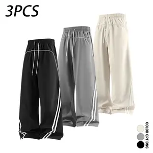 Pack of 3 men’s casual long pants featuring a deconstructed color-block striped patchwork design, loose fit with drawstring elastic waistband; versatile for everyday wear in spring and autumn, suitable for casual sports and fitness.