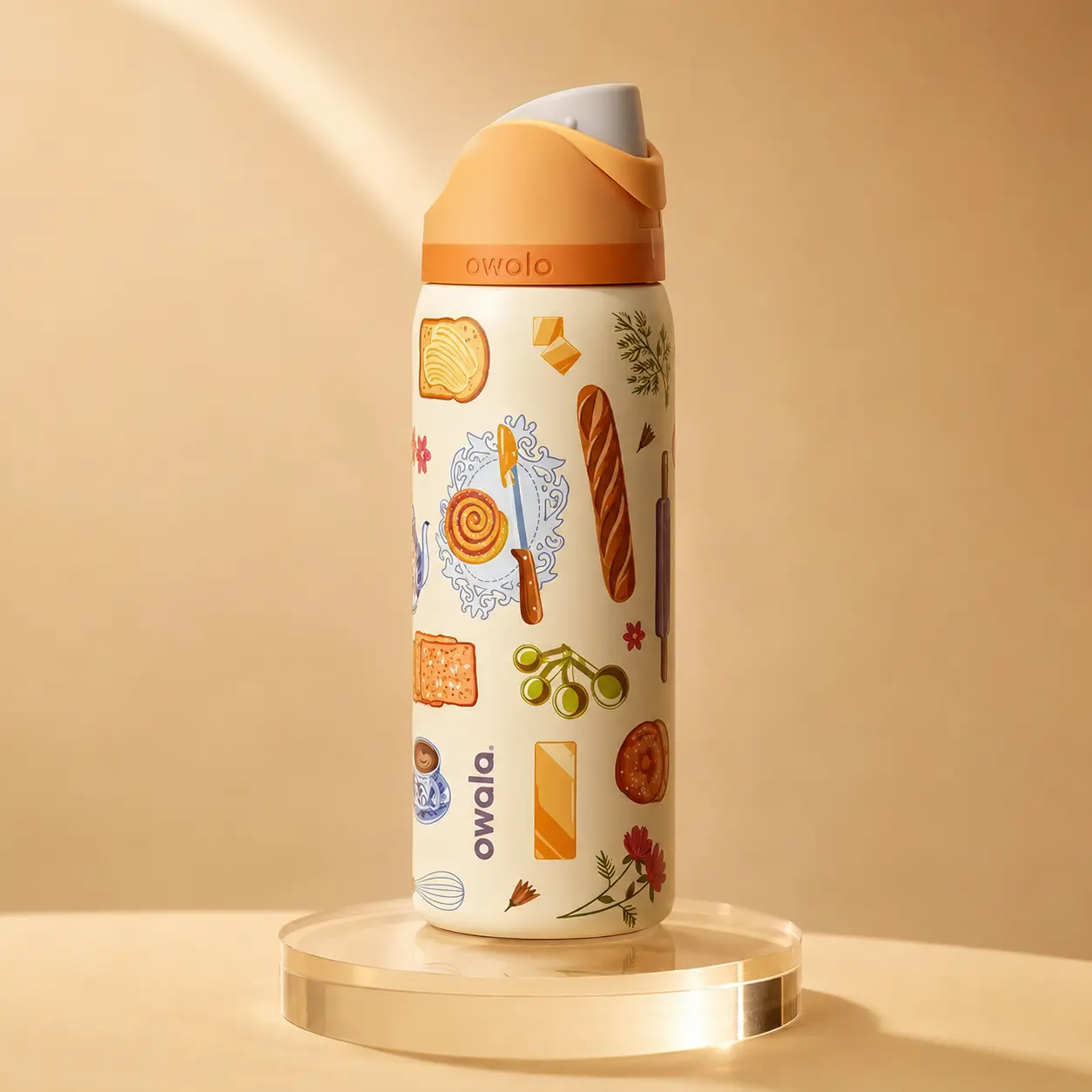 Owala FreeSip Cream Bakery Print Water Bottle, Orange Lid Insulated Stainless Steel Leakproof Bottle with Built-In Straw and Carry Loop