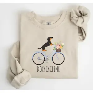 Doxycycline Pharmacy Pun Sweatshirt, Dachshund on Bicycle, Unisex Graphic Tee for Pharmacists and Technicians, Veterinary Gift, Fun Pharmacist Apparel	