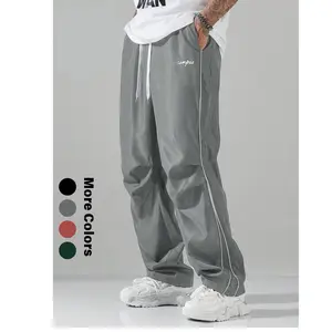 Men’s summer loose athletic pants made from lightweight, soft fabric; relaxed fit with gray side stripes and gold decorative stripes; comfortable casual sports pants for gym wear; 100% polyester fiber.