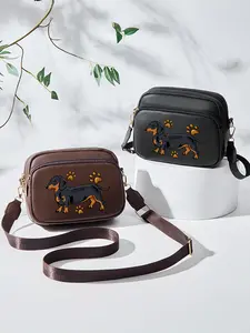 This stylish PU crossbody bag for women features an adjustable shoulder strap and a black and brown dachshund design. It's a perfect gift for mothers and friends, and an ideal choice for Valentine's Day and Ramadan.