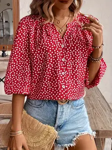 A ladies' red floral V-necked lantern sleeve blouse with a fresh and sweet beachy vibe
