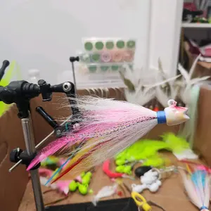 1.5oz custom bucktail jig smailing bill jig style with feathers and flash. model Wonderbread.