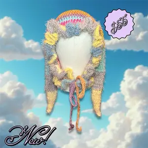 Crochet Jester Hat with Colorful Stripes and fluffy ruffle trim