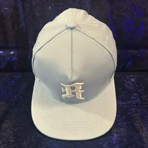 Sky-blue R Hat with Distinctive R Logo for Stylish Wear