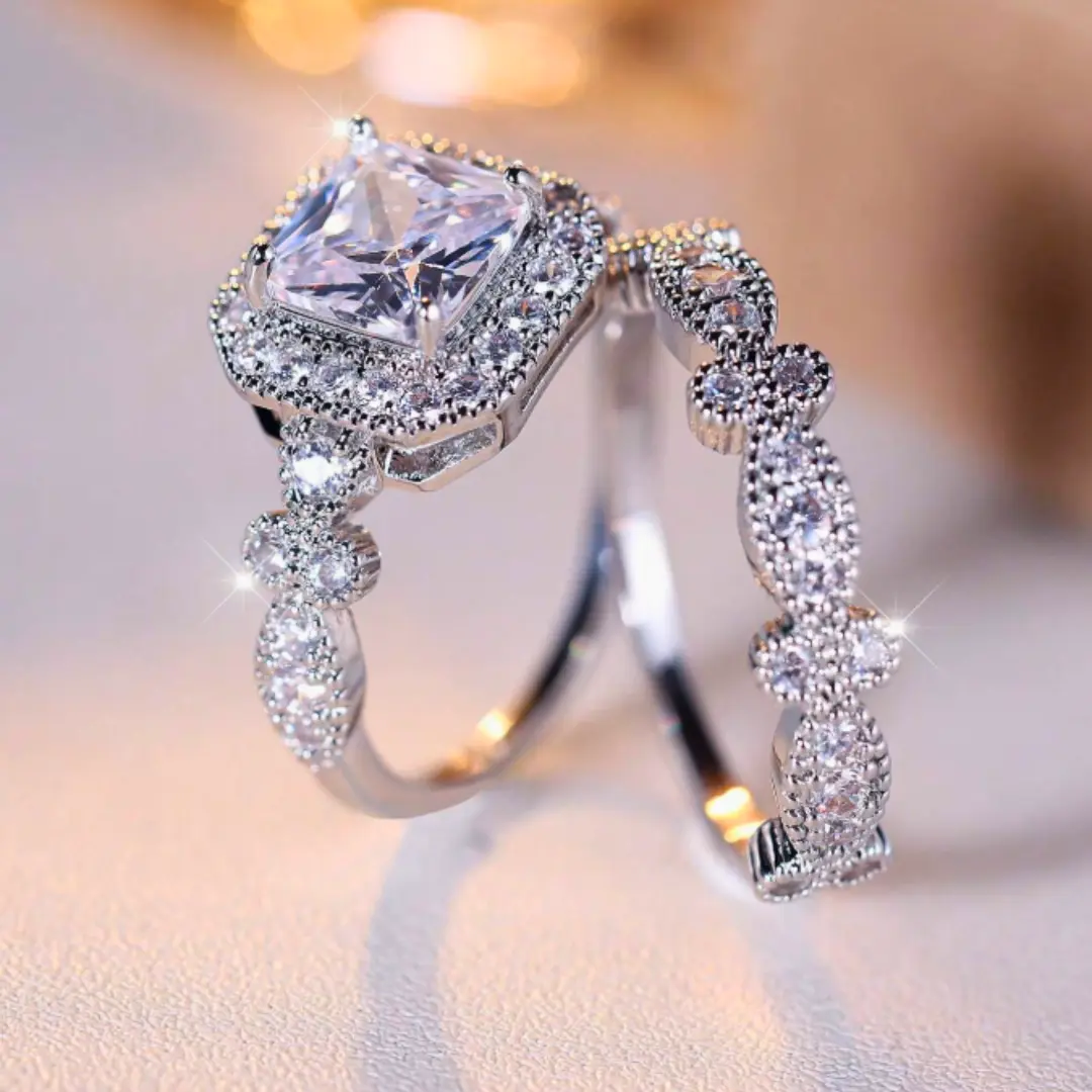 Set of 2 white Cubic Zirconia rings with fashionable and sophisticated square design, suitable as a gift for women to wear at weddings and parties.