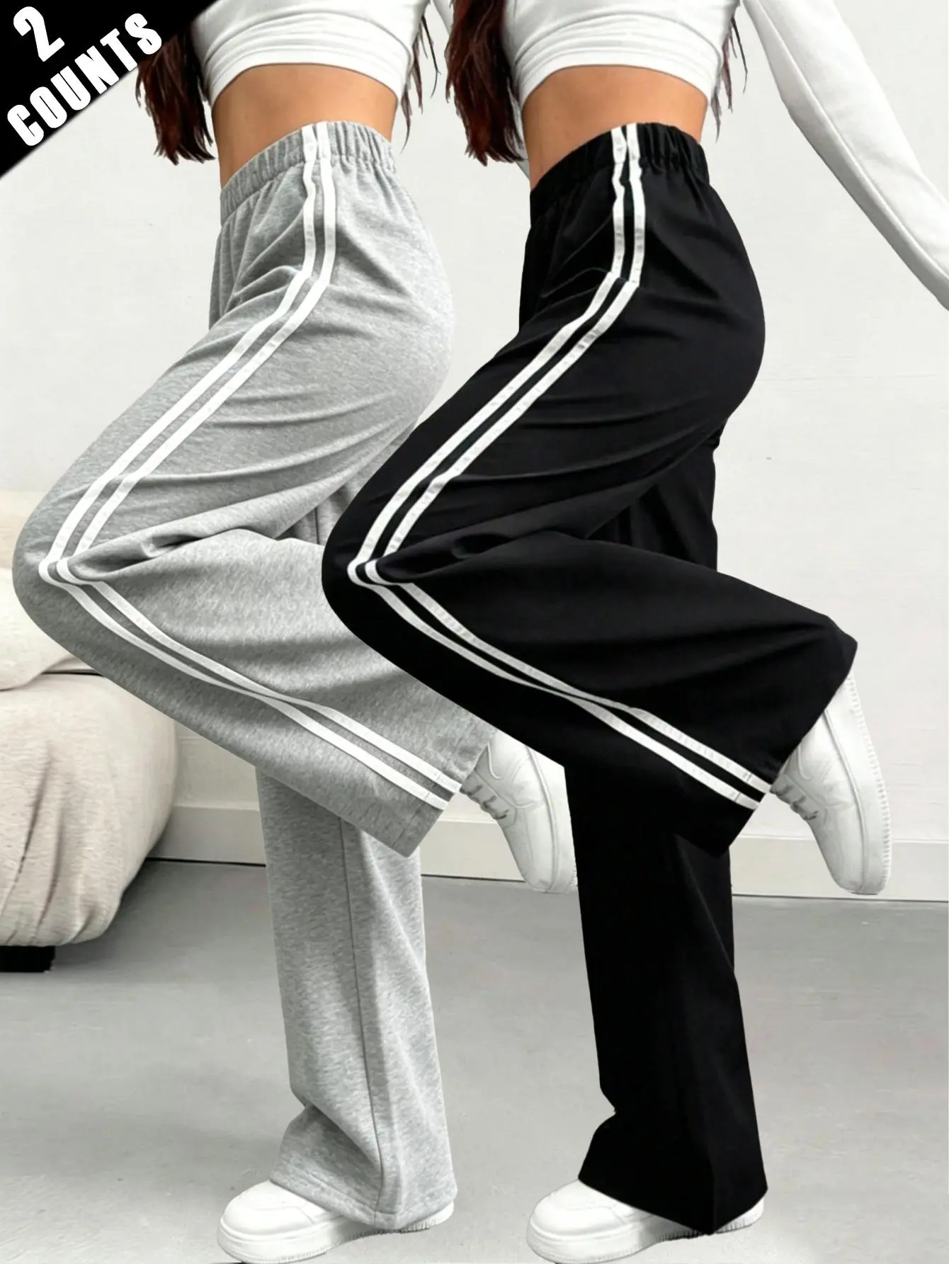 Women’s skin-friendly knit drawstring elastic waistband joggers with side double stripes, long straight-leg design, casual sporty style, slimming fit, versatile for everyday wear and commuting, suitable for spring and autumn.
