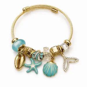 Seashell Charm Bracelet with Starfish, Shell, and Fish Charms in Gold Color