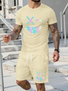 Men’s summer regular-fit cotton short-sleeve T-shirt and shorts set featuring a smiley face print. Fashionable casual menswear for going out, with pockets and an elastic waistband drawstring. Two-piece set suitable for running, golf, fishing, basketball,