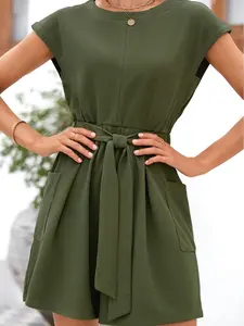 Solid Color Waffle Textured Tie Waist Loose Romper, Relaxed Silhouette, Crew Neck, Short Sleeves, and Tie Waist.