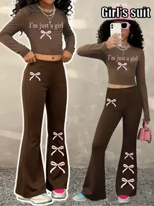 Girls' Spring/Fall New Y2K Fashion Aesthetic Set: Long-sleeve crop top + flared pants (letter & bow print). Unique color-block design for a niche look, ultra-soft fabric for all-day comfort. Casual & stylish—ideal for playdates, outings or daily wear!