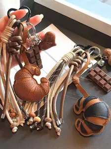 Bull horn chocolate woven tassel pendant, retro exquisite and fashionable versatile pendant, contrasting knot, heart decoration, can be used as a bag hanging and keychain, suitable for daily commuting and shopping, Trendy Cute Keychain